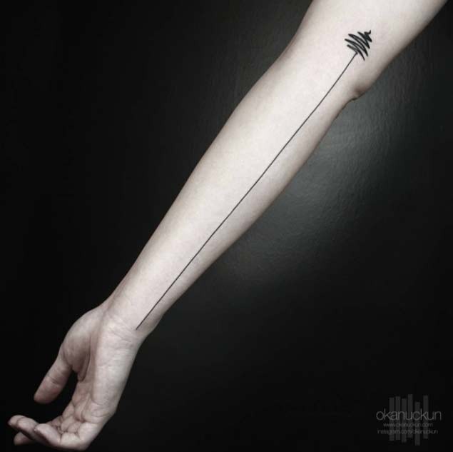 Usual black ink forearm tattoo on long sound wave