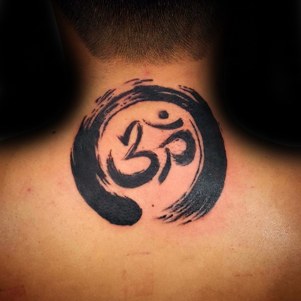 Usual black ink simple circle shaped tattoo on back with Hinduism symbol