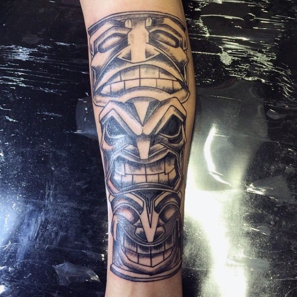 Usual black ink various masks tattoo on arm