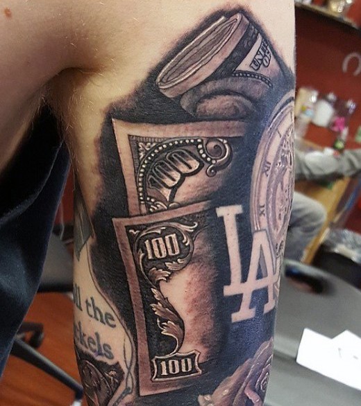 Usual colored and detailed dollar money bills tattoo on shoulder with old clock