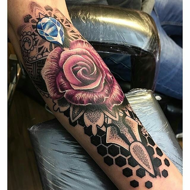 Usual colored rose with diamond arm tattoo combined with stippling style ornaments