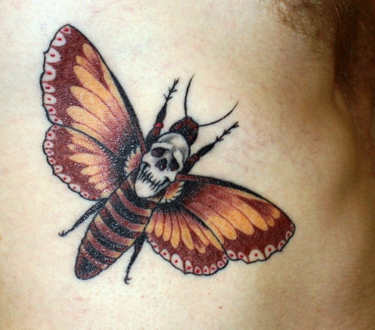Usual colored side tattoo of butterfly with skull