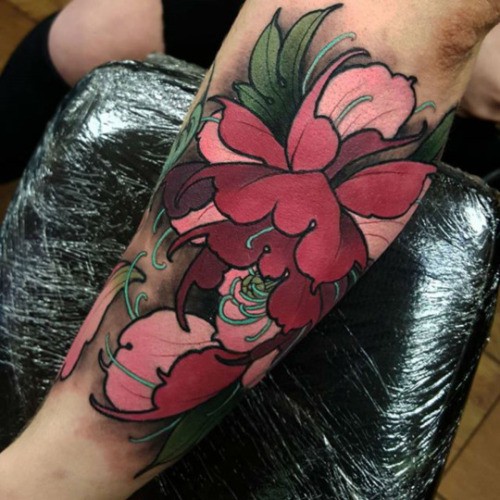 Usual designed and painted arm tattoo of cute flower