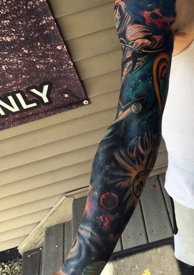 Usual painted big space tattoo on sleeve