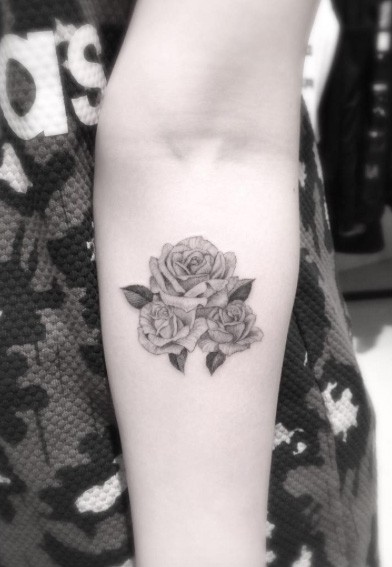 Usual painted little black ink forearm tattoo of three rose flowers