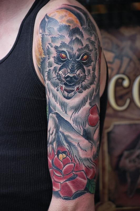Usual style colored shoulder tattoo of creepy wolf with rose