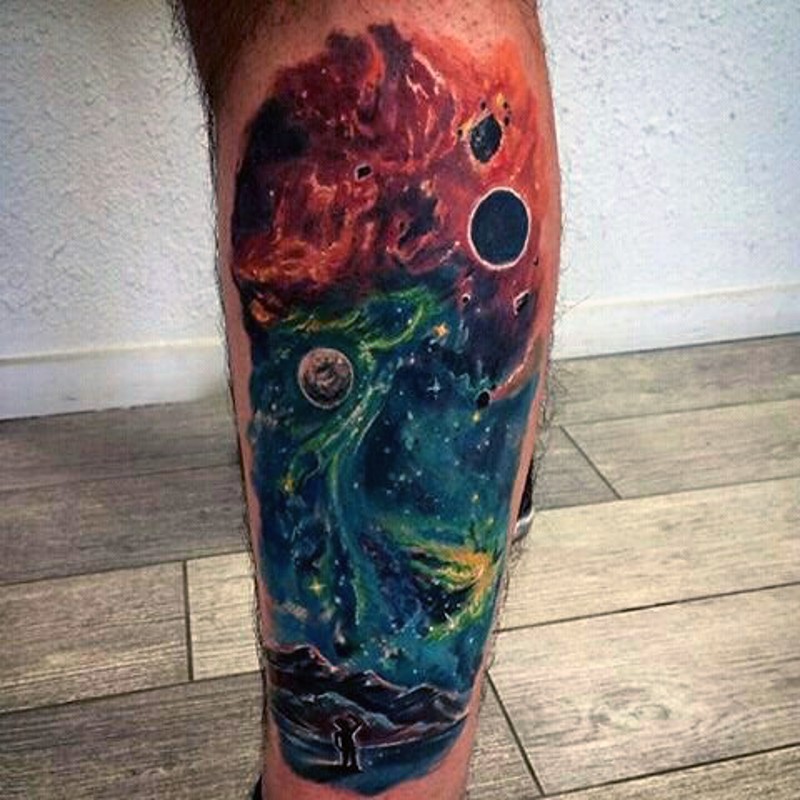 Usual style colored space tattoo on leg