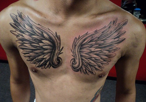 Usual style painted 3D like black and white wings tattoo on chest
