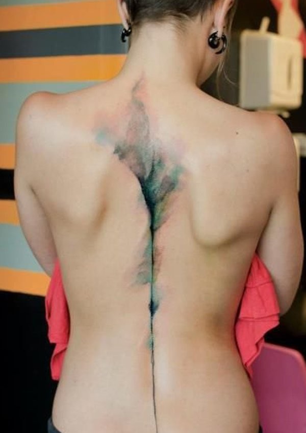 Usual watercolor like abstract tattoo on back