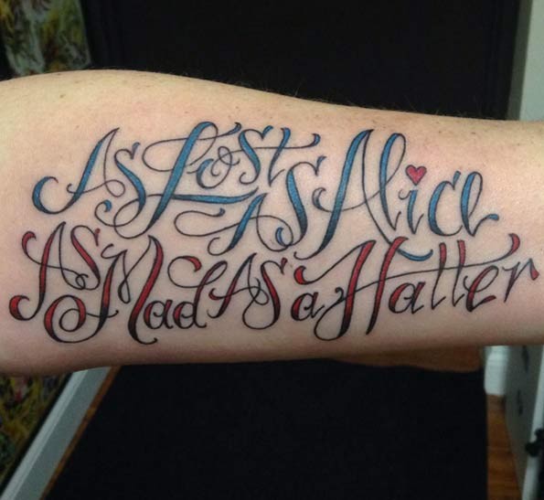 Variety colors designed literary style lettering forearm tattoo Alice in Wonderland themed