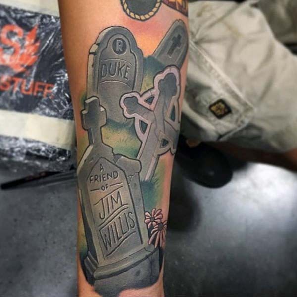 Various style designed colored tombstones with lettering tattoo on arm
