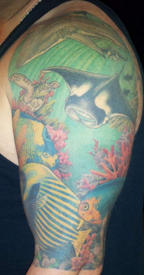 Vary realistic painted and detailed massive underwater life tattoo on shoulder