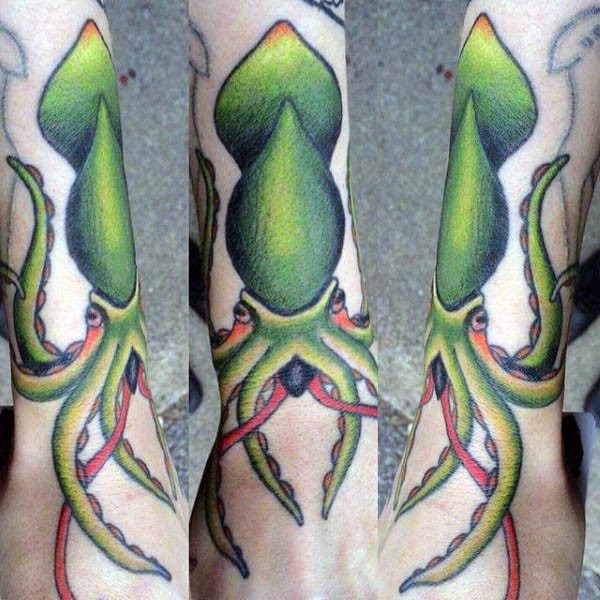 Very beautiful colored little squid tattoo on wrist