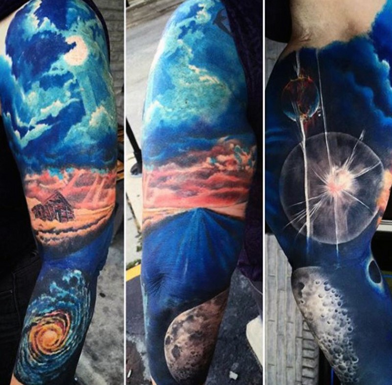 Very beautiful designed colorful space and Earth themed tattoo on sleeve