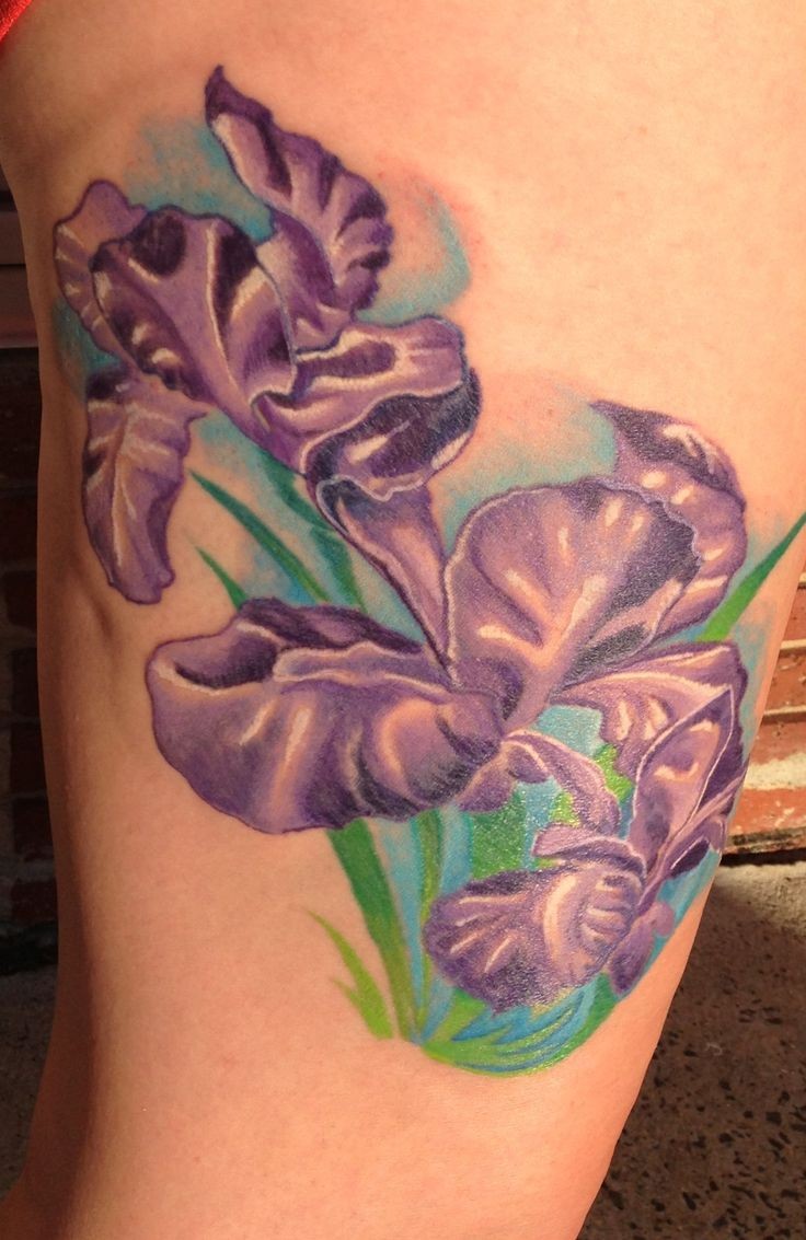 Very beautiful looking colored thigh tattoo of small flowers