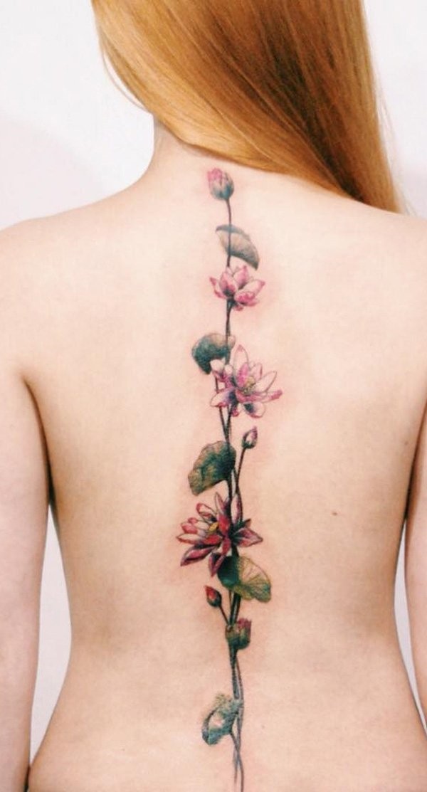 Very beautiful pink colored long tattoo on back