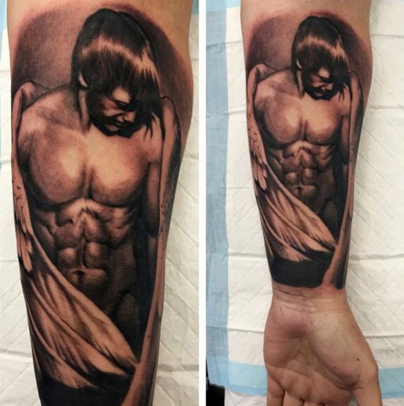 Very detailed black ink angel boy tattoo on forearm