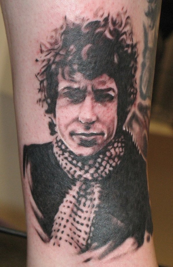Very detailed black ink forearm tattoo of mans portrait