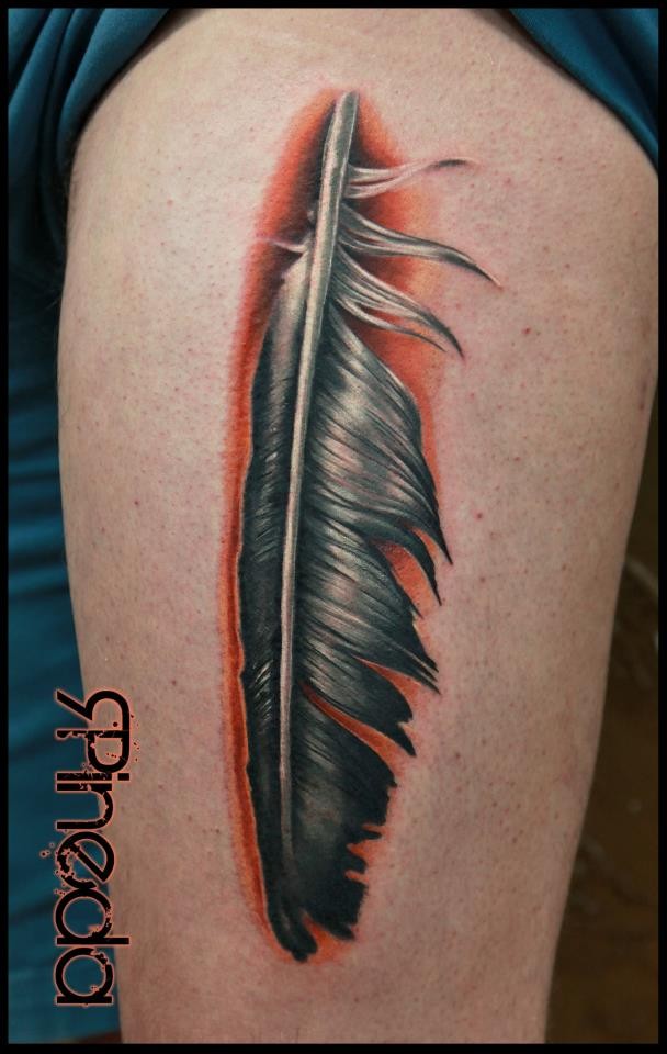 Very detailed colorful arm tattoo of bird feather