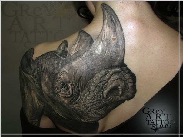 Very detailed large realism style scapular and shoulder tattoo of rhino head