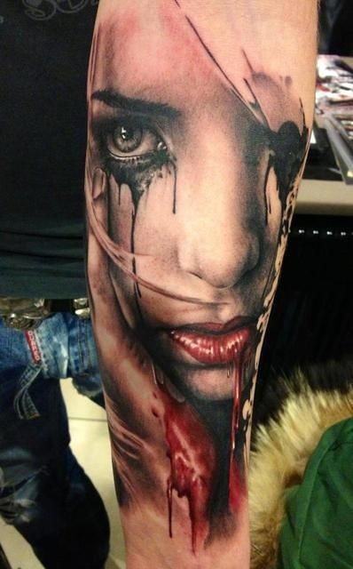 Very detailed multicolored crying bloody woman tattoo on arm