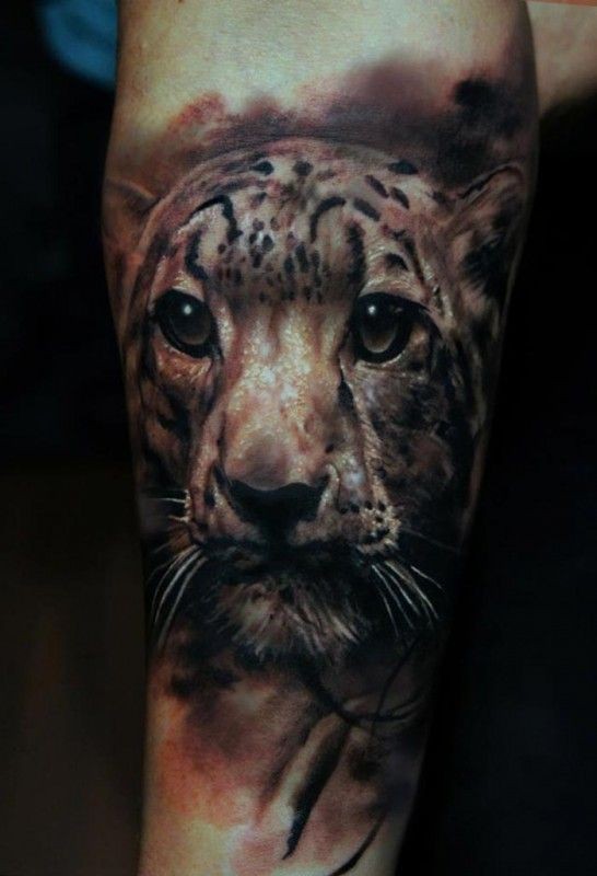Very nice leopard head tattoo by Domantas Parvainis