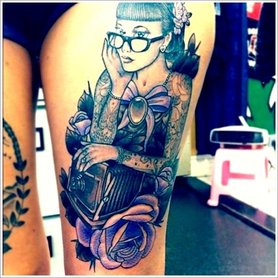 Very realistic colored beautiful woman with old camera tattoo on thigh