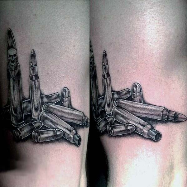 Very realistic detailed 3D like various bullets tattoo on arm