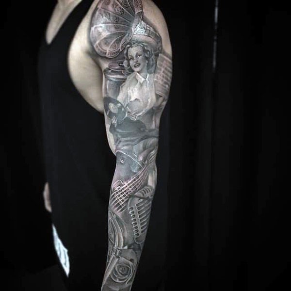 Very realistic looking black and white vintage musical tattoo on sleeve