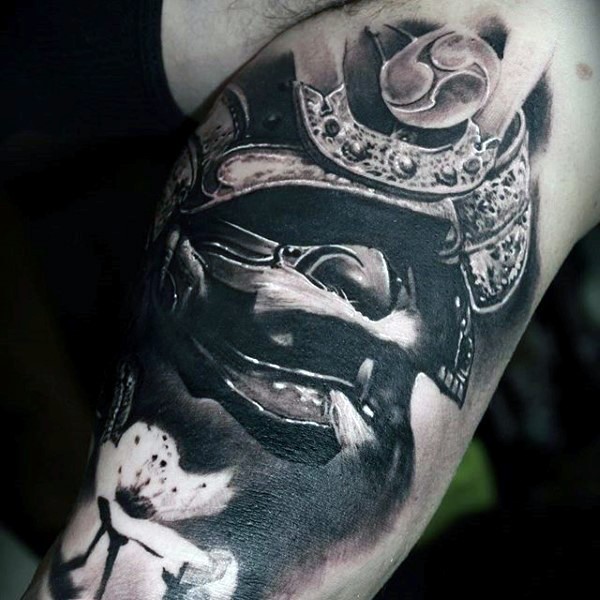 Very realistic looking black and white samurai helmet tattoo on arm with white flower
