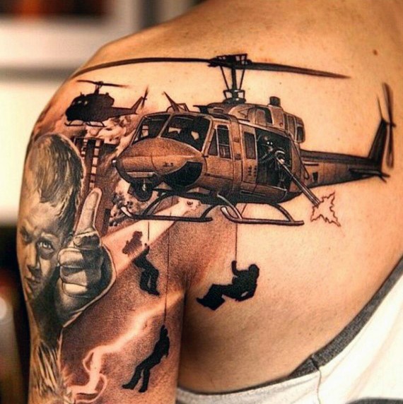 Very realistic looking black and white military helicopters tattoo on shoulder
