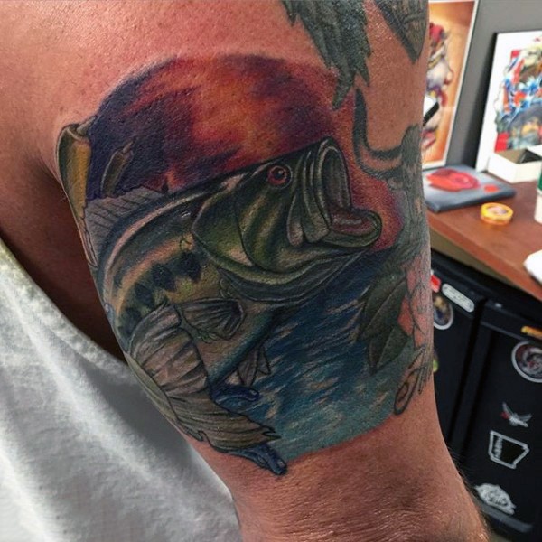 Very realistic looking colored big fish tattoo on arm