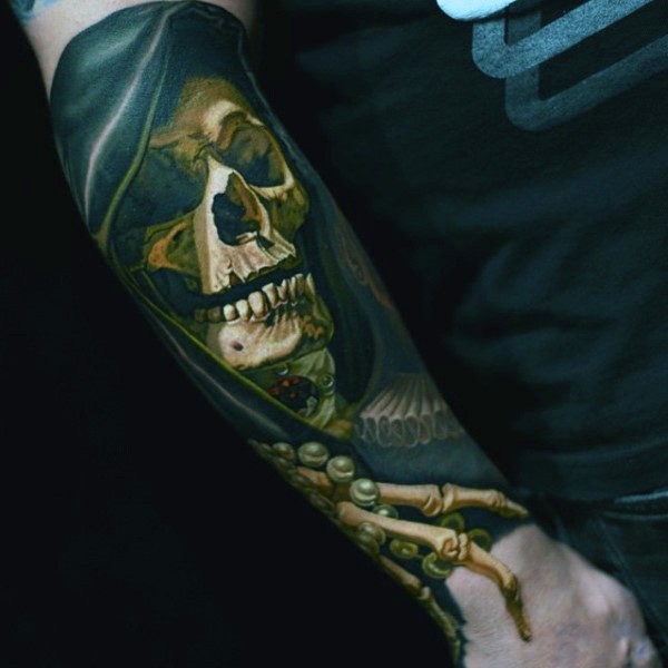 Very realistic looking creepy skeleton in cloak tattoo on arm