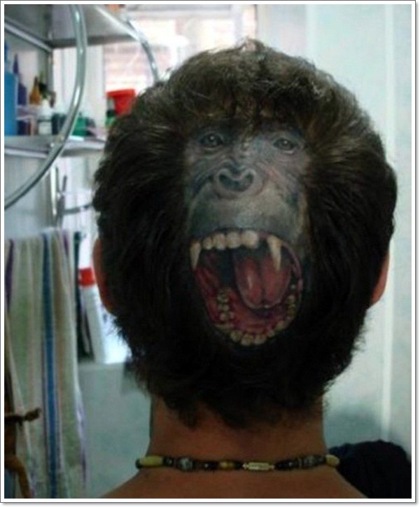 Very realistic looking original placed roaring monkey face tattoo on head