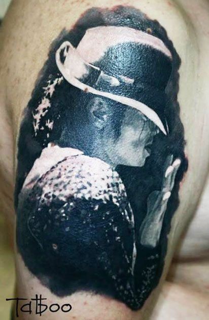 Very realistic looking photo like black and white Michael Jackson portrait tattoo on shoulder