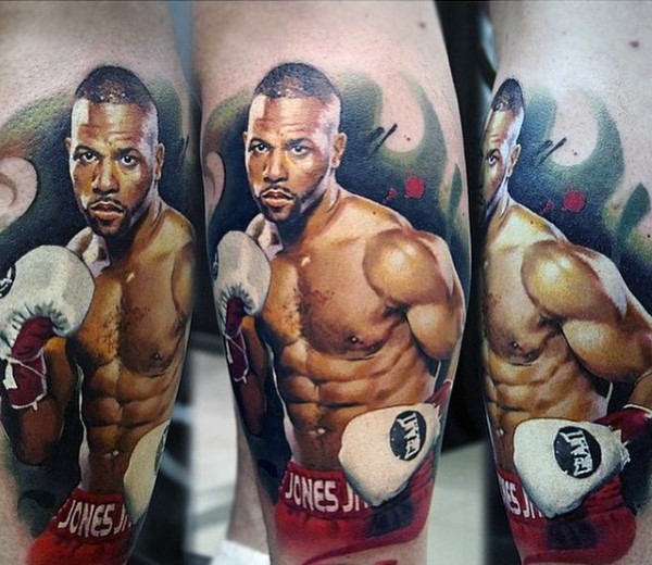 Very realistic looking photo like colored famous boxer tattoo on leg