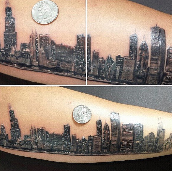 Very realistic looking spectacular forearm tattoo of city sights