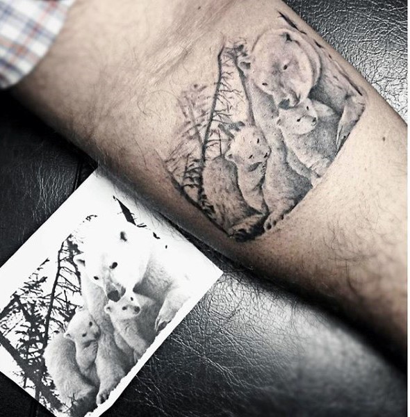 Very realistic looking white bear family tattoo on arm