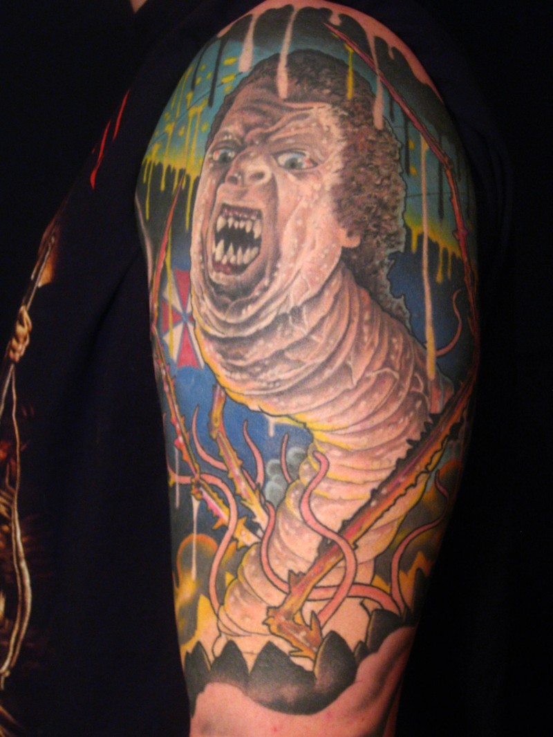 Very unusual style painted creepy half worm half man tattoo on shoulder