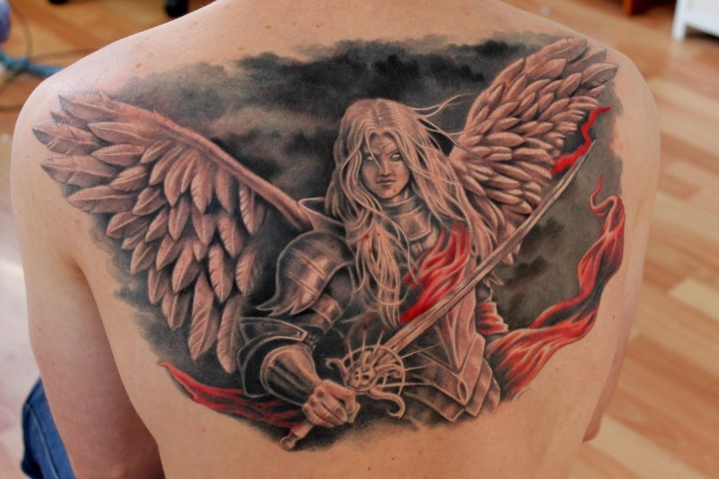 Video games style colored upper back tattoo of fantasy angel warrior