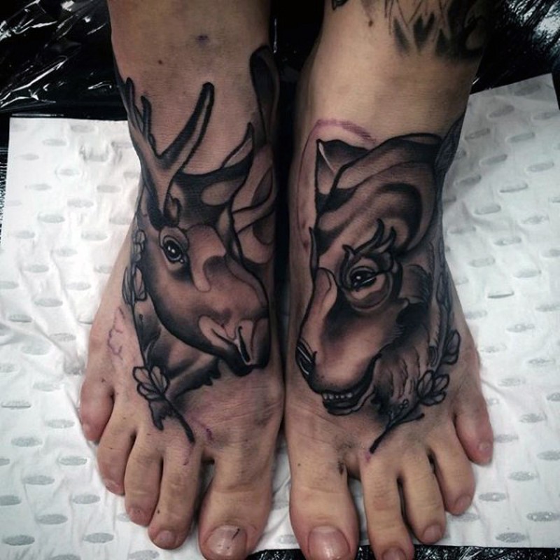 Vintage black ink feet tattoo of elk and goat heads