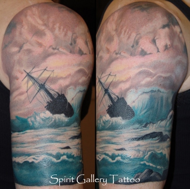 Vintage picture like shoulder tattoo of sailing ship in stormy sea