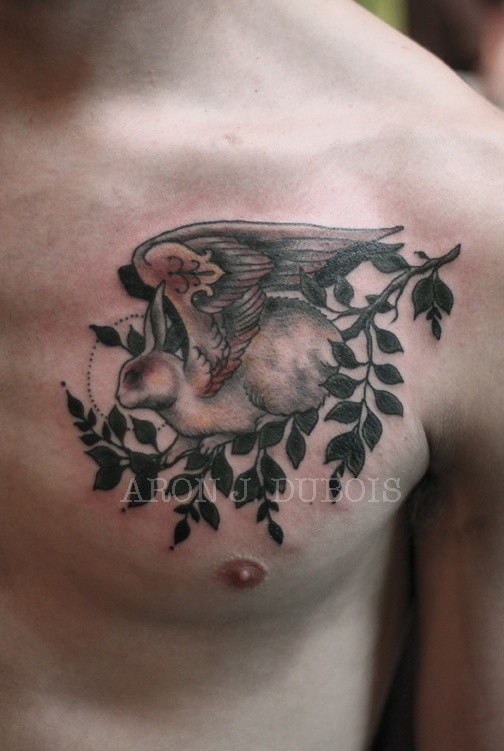 Vintage picture style colored chest tattoo of fantasy animal with wings and tree branch