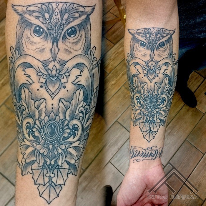 Vintage picture style detailed forearm tattoo of large owl with jewelry