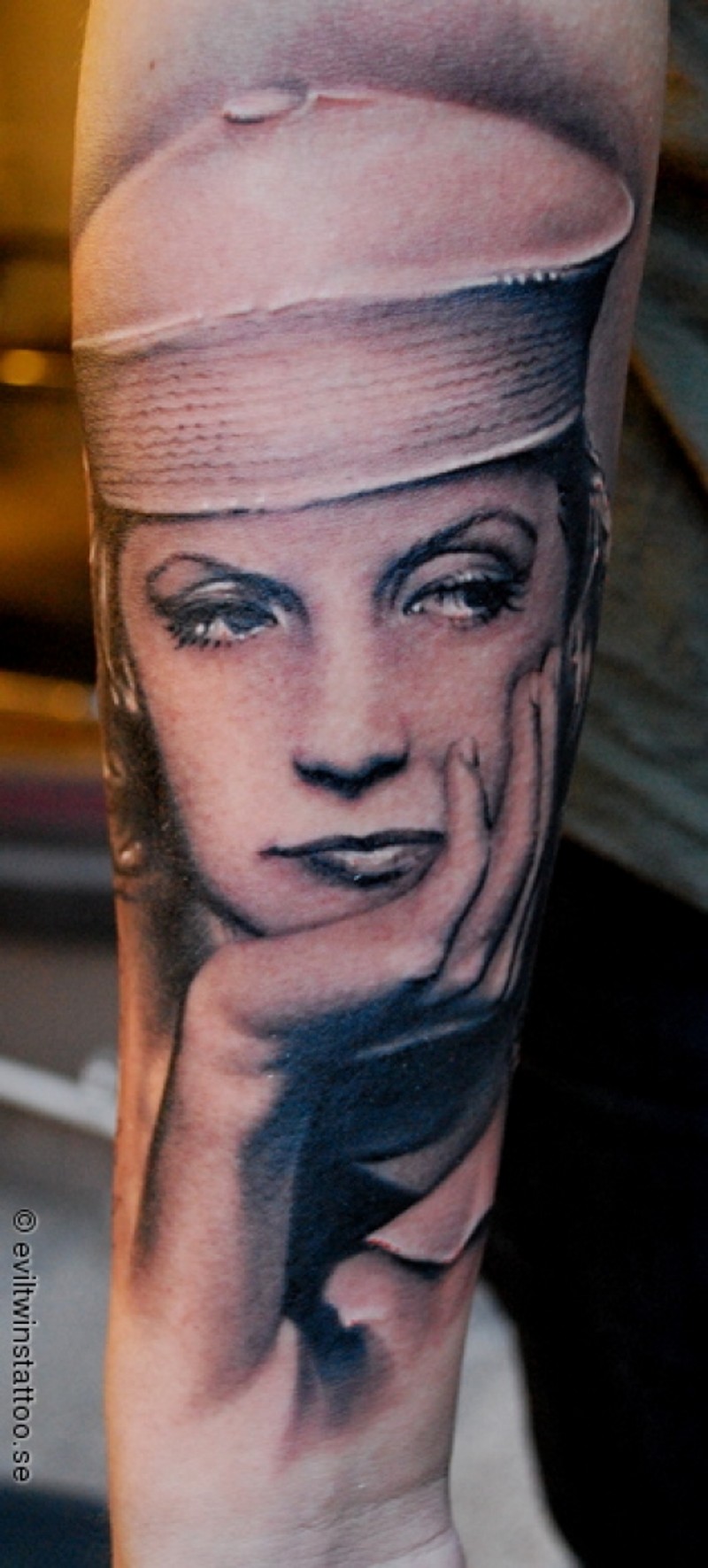 Vintage style beautiful woman black ink tattoo on forearm
