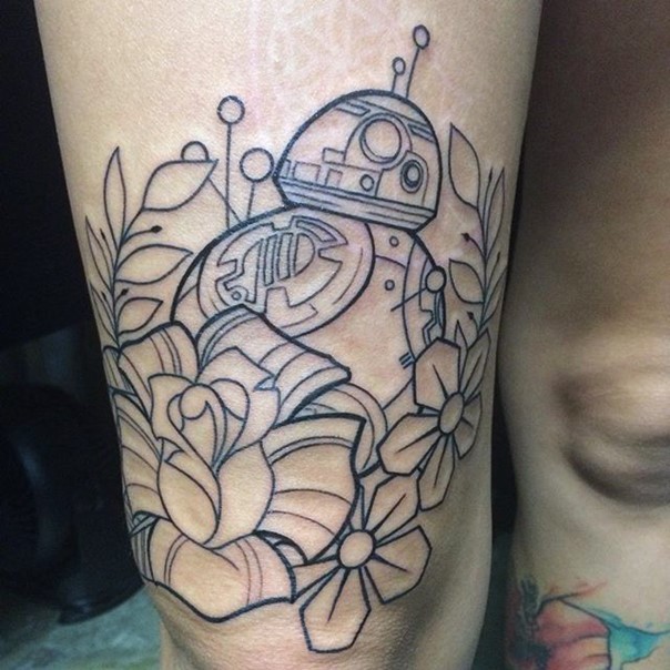 Vintage style big uncolored thigh tattoo of star droid with flowers pattern
