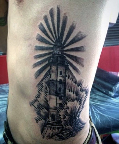 Vintage style black and white side tattoo of big waves and lighthouse