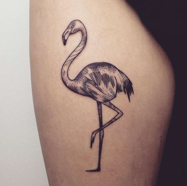 Vintage style black ink flamingo tattoo on thigh area