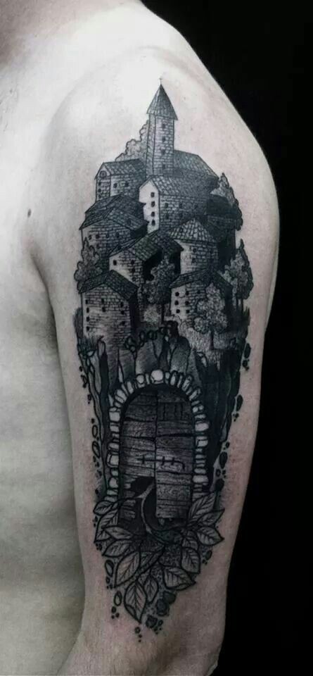 Vintage style black ink shoulder tattoo of old medieval town with gates