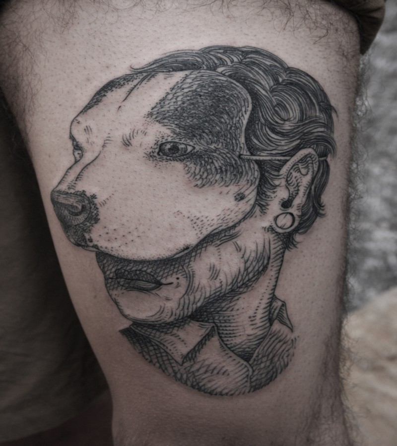 Vintage style black ink thigh tattoo of woman with dog mask